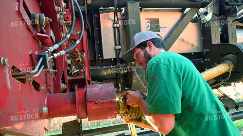 Farmer Connecting PTO onto Combine Head 25528