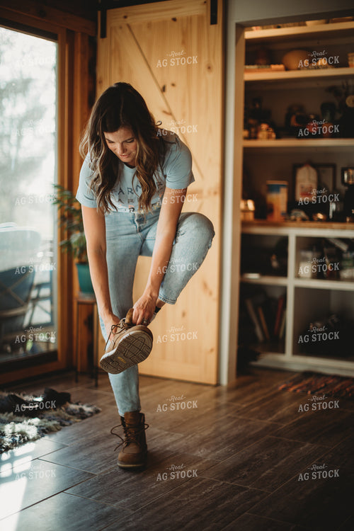 Farmer Putting on Shoes 6812