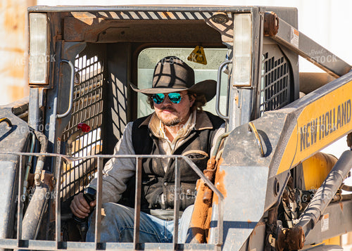 Rancher Operating Skid Steer 231040