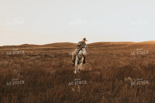 Cowboy Riding Horse 61204