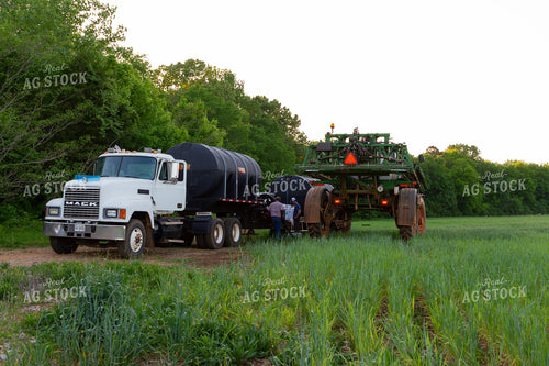 Male Farmers Filing Up Sprayer 79004