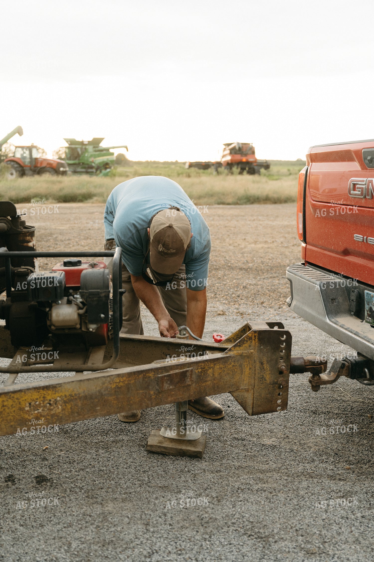 Farmer Hooking Up Trailer 125270