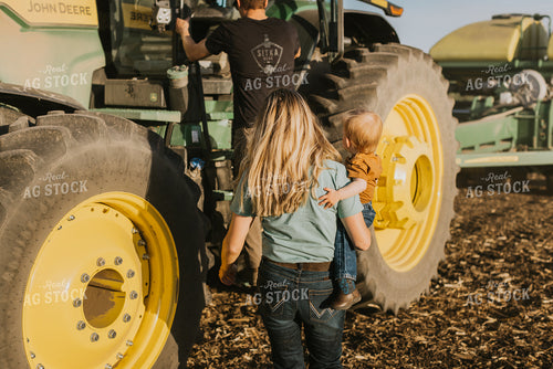 Young Couple with Child Walk Toward Tractor 7666