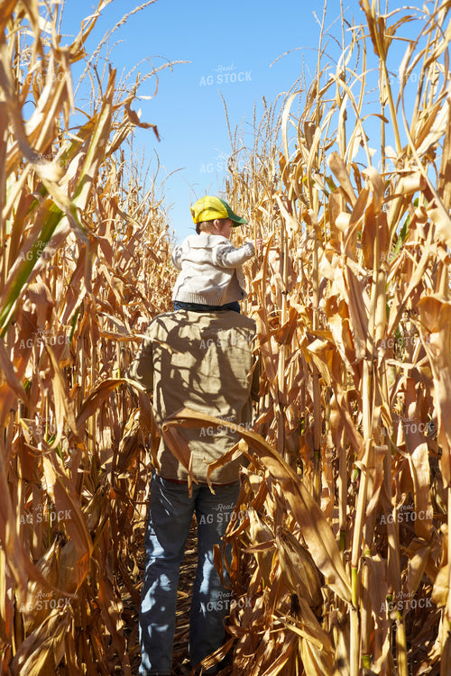 Farmer and Farm Kid in Dried Corn Field 65608