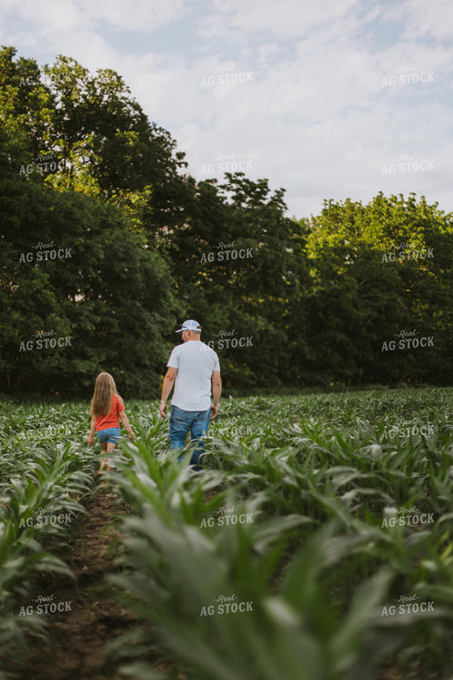 Farmer and Daugther Checking Corn 8747
