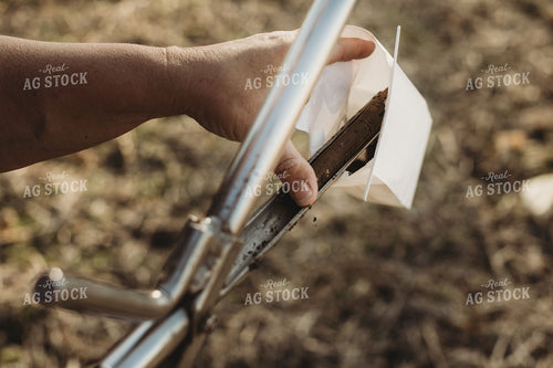 Farmer Putting Soil Core in Soil Sample Bag 3722