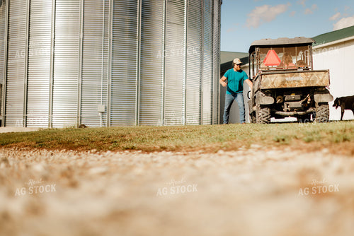 Farmer Getting into Side by Side 9353