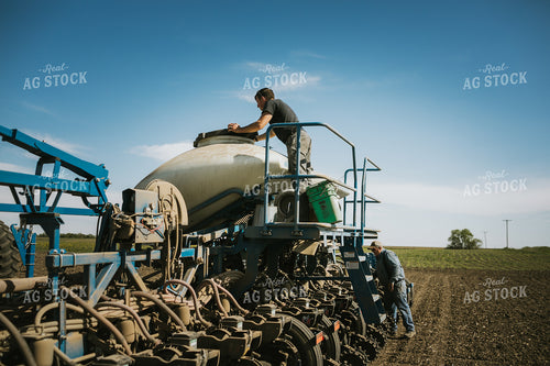 Farmer Checking Seed Level in Bulk Fill Planter 4273