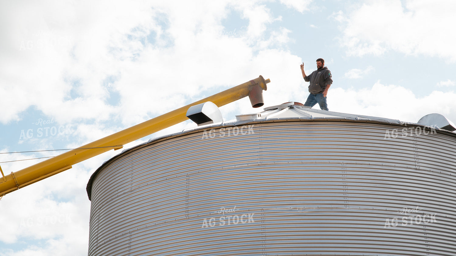 Farmer Lining Up Auger 26272