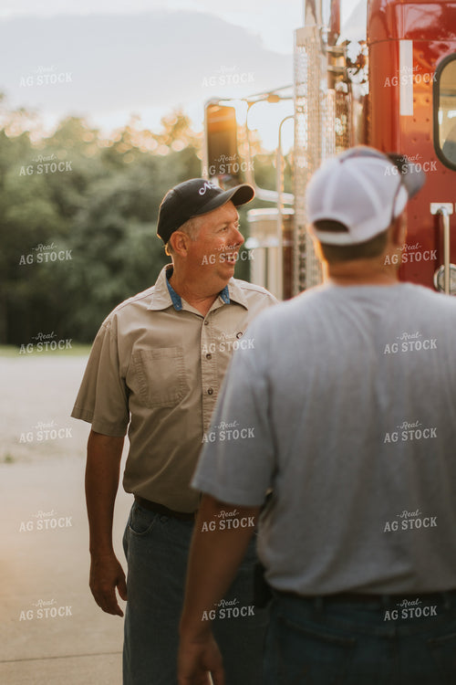 Farmers Talking by Semi Truck 7788