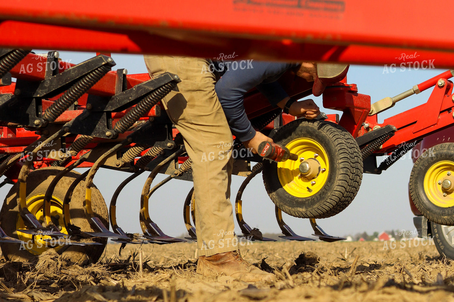 Farmer Working on Field Cultivator 109081