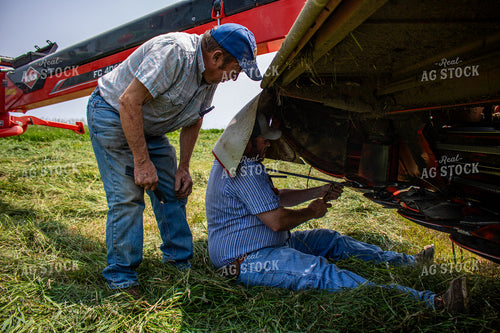 Farmers Fixing Hay Cutter 214142
