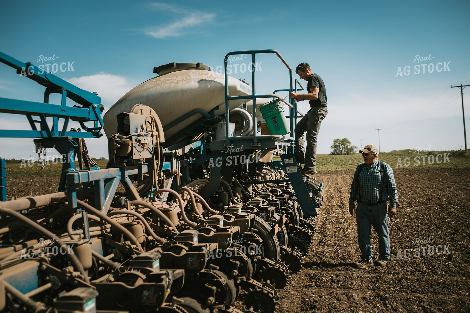 Farmer Checking Seed Level in Bulk Fill Planter 4275