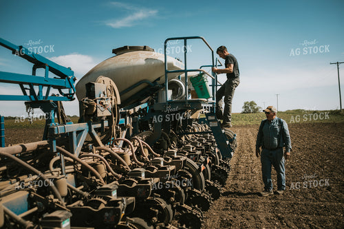 Farmer Checking Seed Level in Bulk Fill Planter 4275