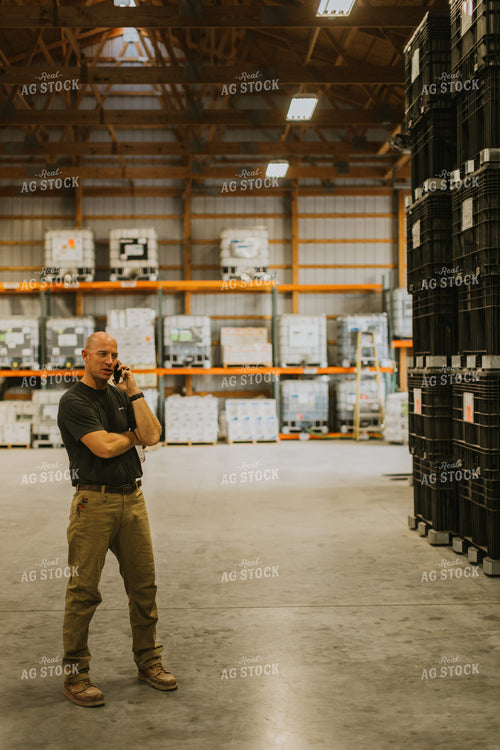 Farmers Talks on Phone in Seed Shed 7633