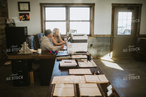 Man and Woman Going Over Paperwork 5295