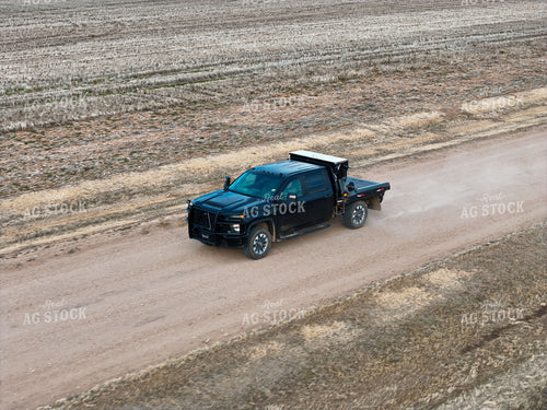 Truck with Bale Bed Driving on Dirt Road 239134