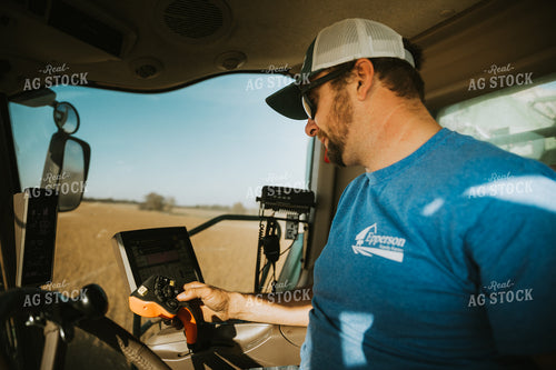 Farmer Operating Combine 7099
