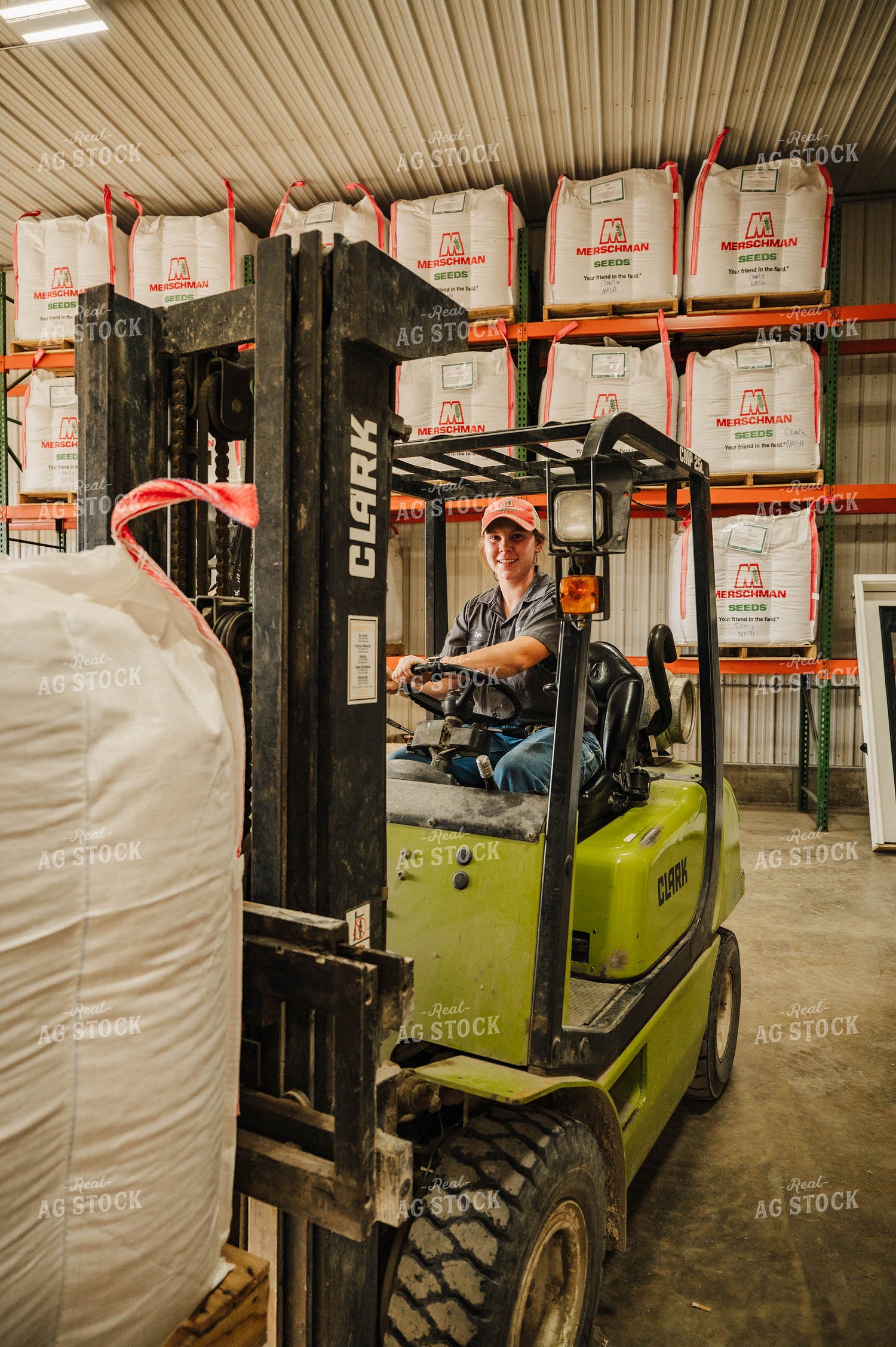 Female Farmer Driving Skid Steer 115240