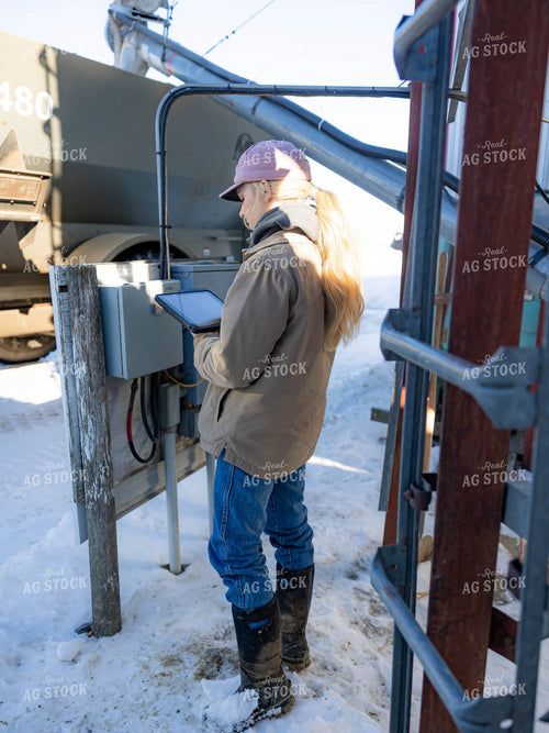 Rancher Looking at Tablet 70208