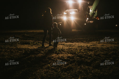Farm Mom and Son Waiting for Tractor in Field at Night 5161