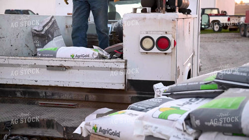 Loading Seed Bags into the Truck - 060