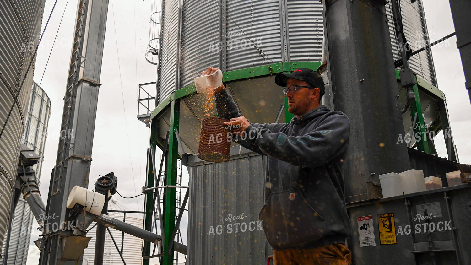 Farmer Testing Corn Moisture On-farm Storage 25620
