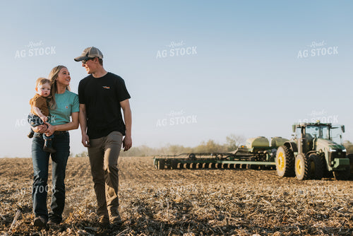 Young Couple with Child Walk Away from Tractor 7673