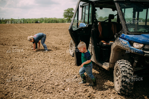 Farm Kid and Mom Picking Up Rocks 169095