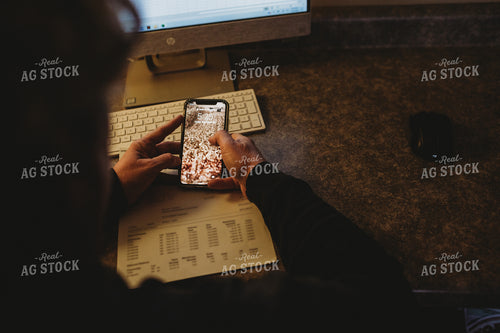 Farmer Using Smart Phone for Farm Accounting 3703