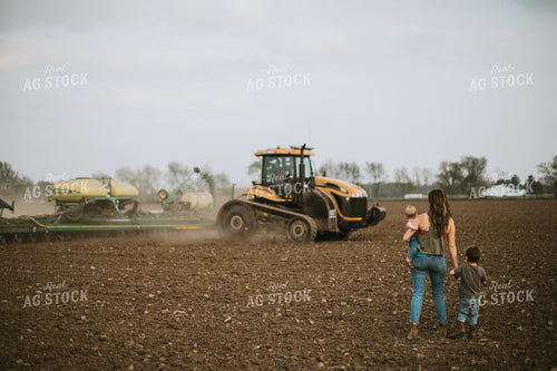 Farm Mom Taking Kids Out to Tractor During Planting 5637