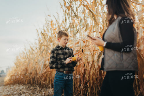 Farm Wife and Kid Checking Corn 9468
