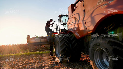 Farmer Climbing into Combine 25530