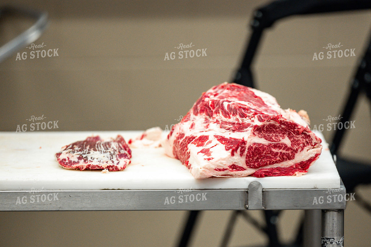 Heavily Marbled Raw Beef Cuts on Commercial Butcher Table 414002