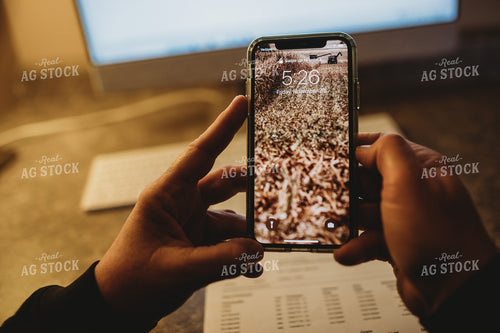 Farmer Using Smart Phone for Farm Accounting 3705