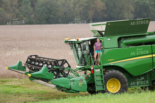 Female Farmer Standing on Combine 52255