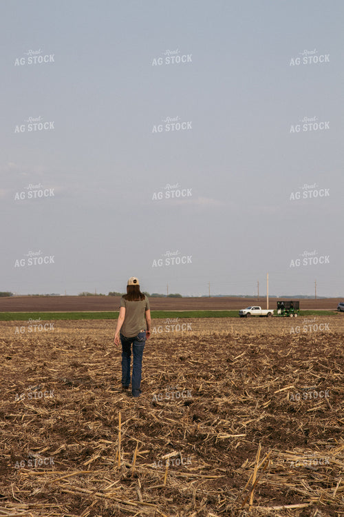 Female Farmer Walking in Newly Planted Field 67322