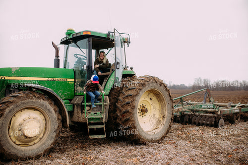 Farm Kid on Side of Tractor 169069