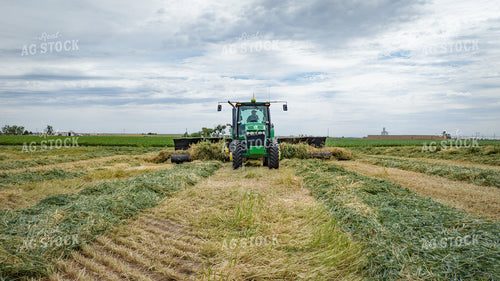 Tractor with Merger in Hay Field 56415