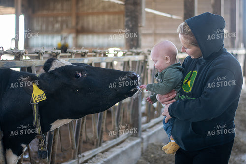 Female Farmer and Son with Holstein 50486