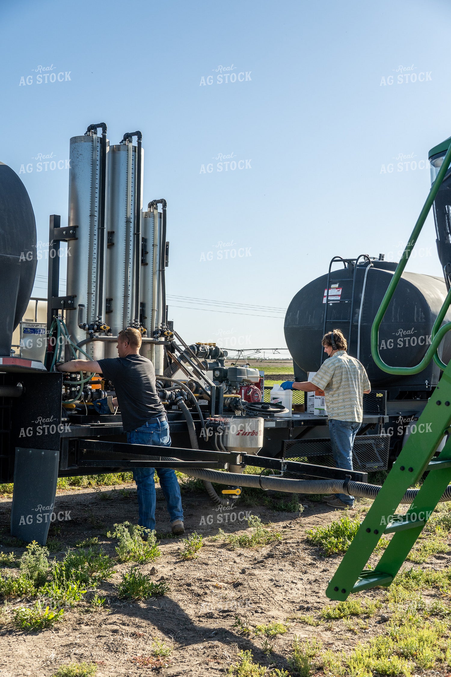 Farmers Mixing Chemicals 65717