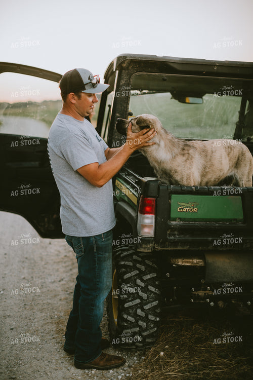 Farmer Petting Dog in Side by Side 6153