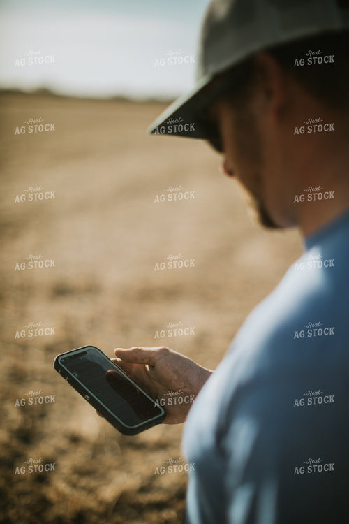 Farmer on Phone in Field 7139