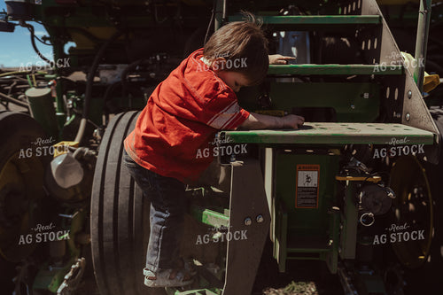 Farm Kid Helps with Test Plot 196135