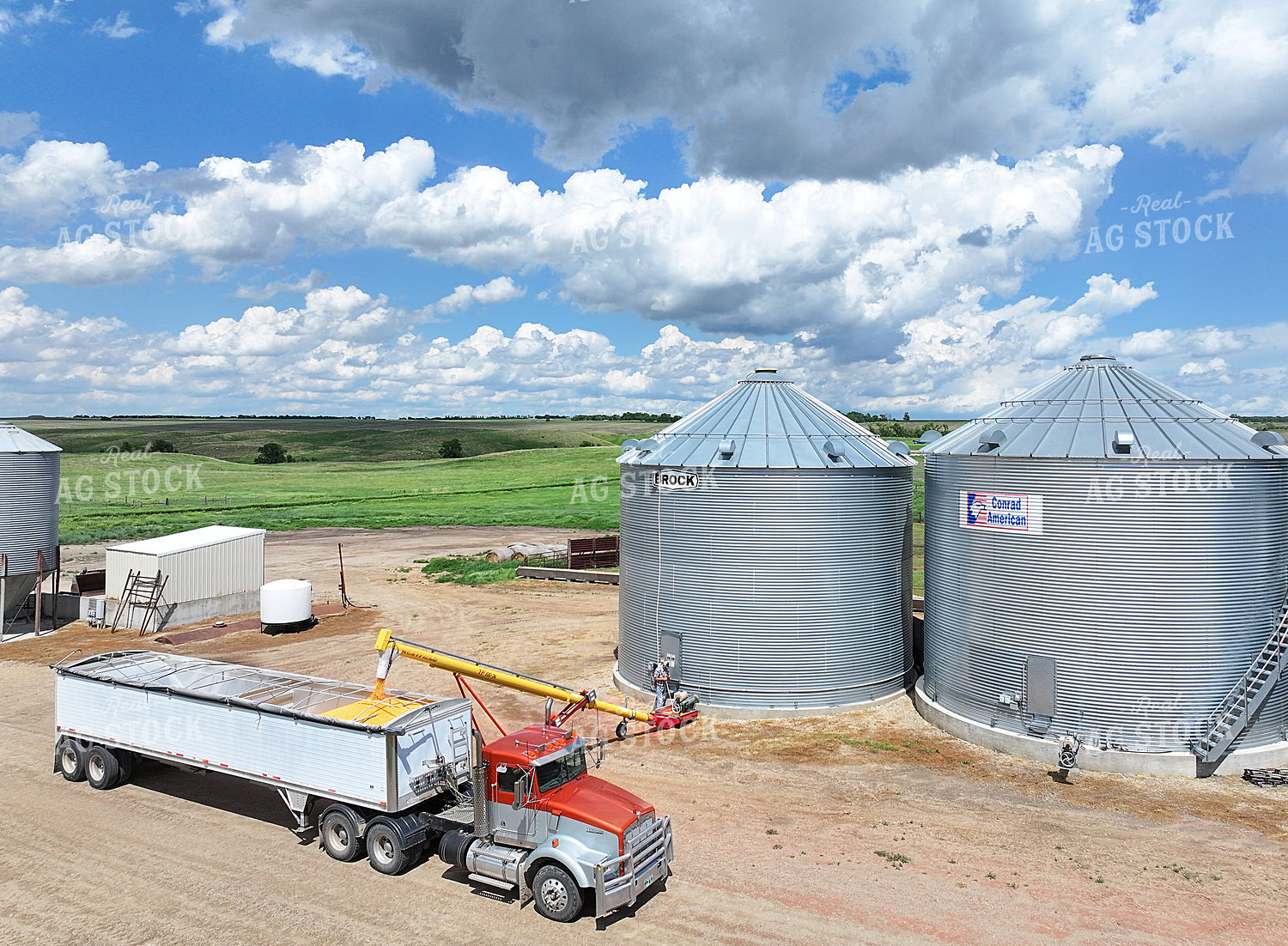 Unloading Bins and Hauling Grain 141566