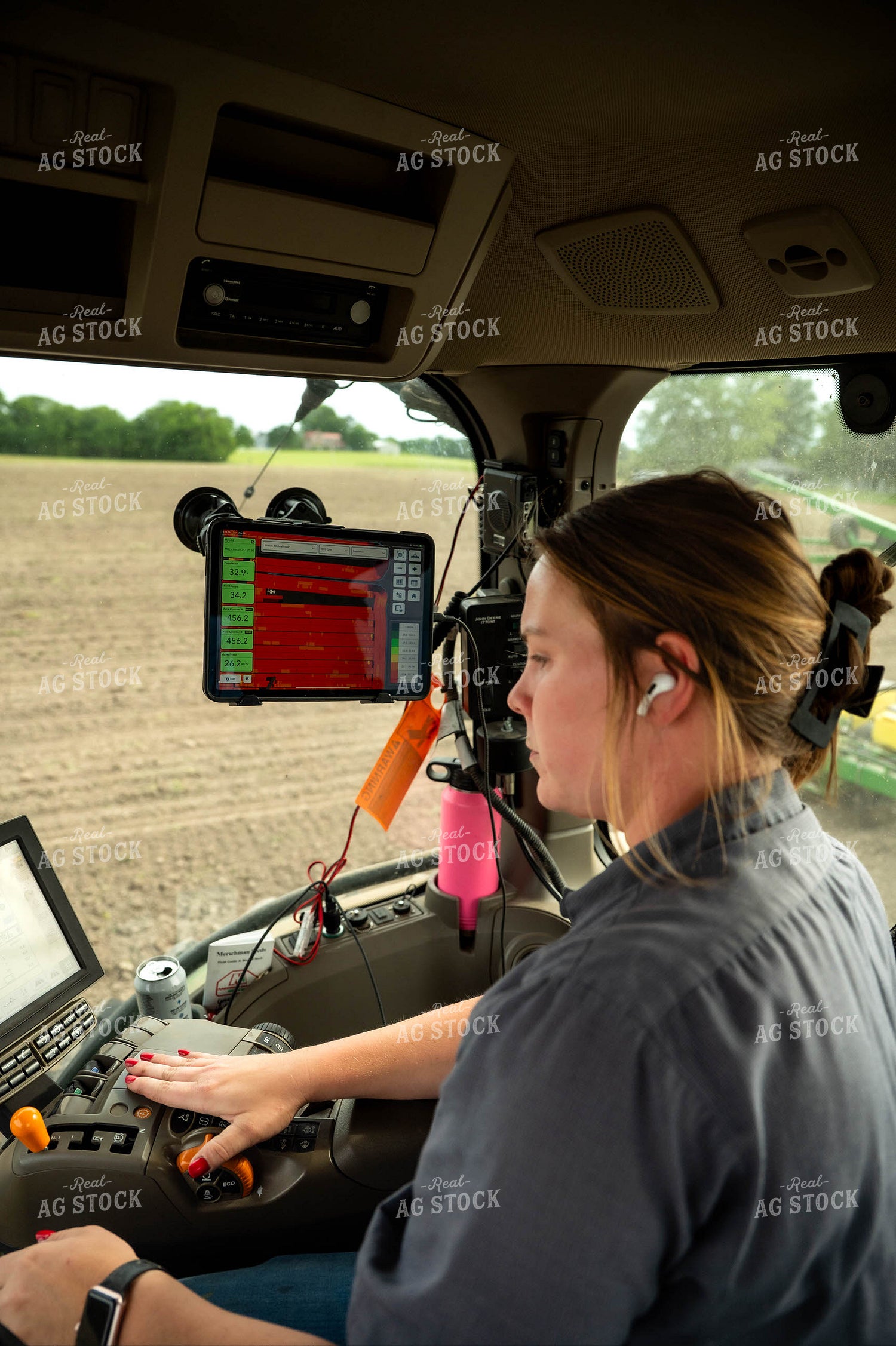 Female Farmer in Tractor Cab 115662