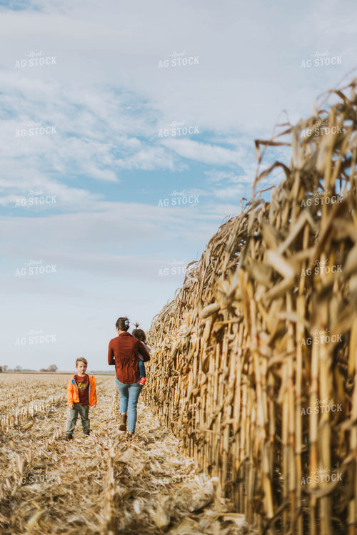 Female Farmer and Kids Checking Corn 8514