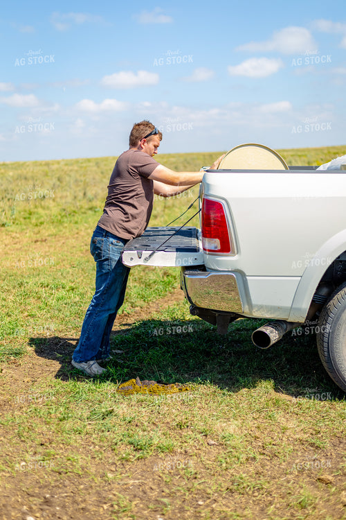Farmer Putting Out Licktubs 155271