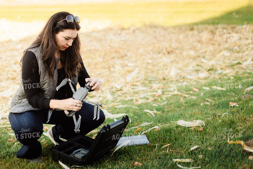 Female Appraiser Flying Drone 9434