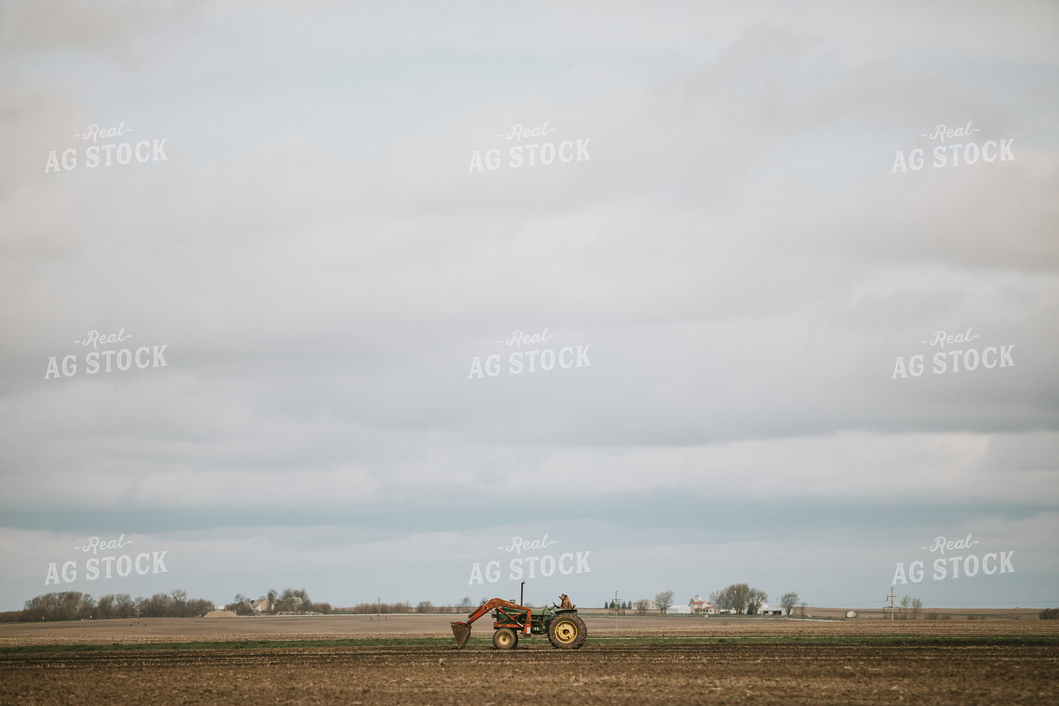 Farmer on Loader Tractor 5396